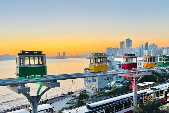 Experience Busan's unique sky capsule as it glides above picturesque waters and cityscapes offering views that blend scenic beauty with local charm perfect for an unforgettable adventure.